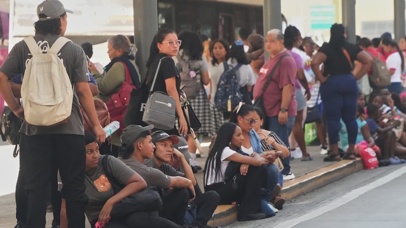 People gather outside shopping mall after an earthquake hit Panama City, Friday, Oct. 9, 2026....